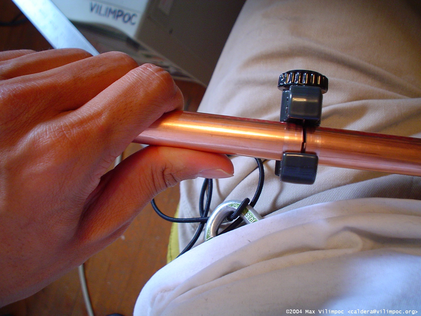 Cutting through the copper pipe using a pipe cutter