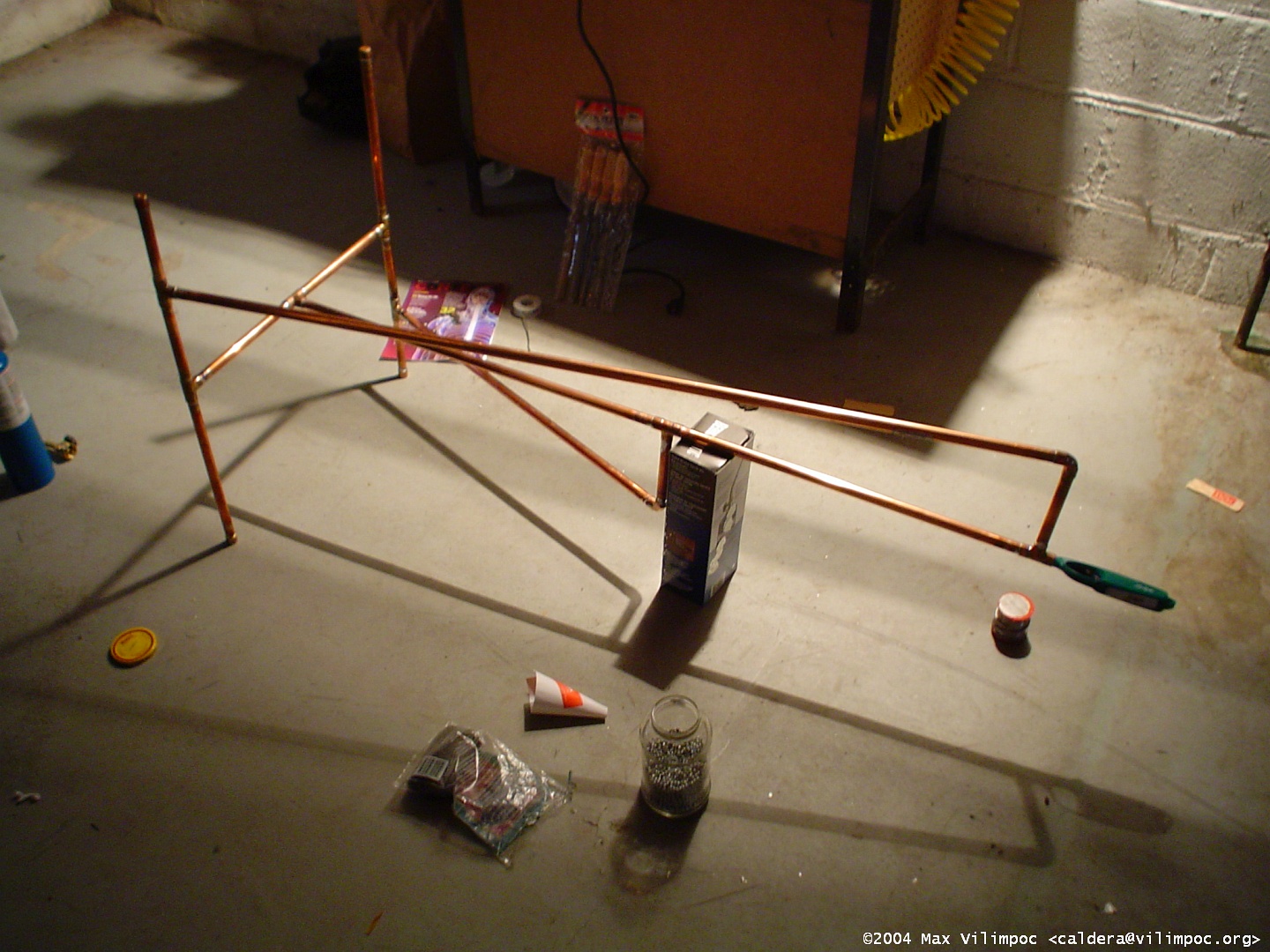 The full stand being soldered togehter in the basement, there were some added diagonal supports built with tubing added to reinforce the main vertical tube