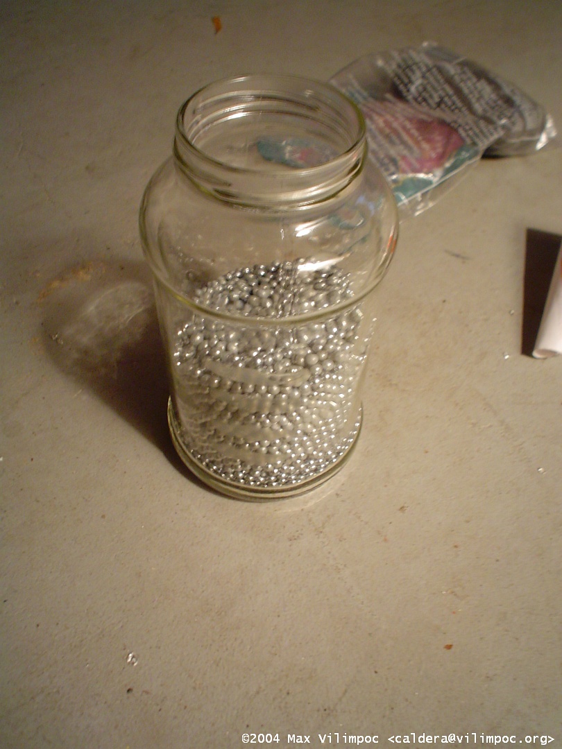 A glass mason jar filled with BBs which will be used as a counterweight