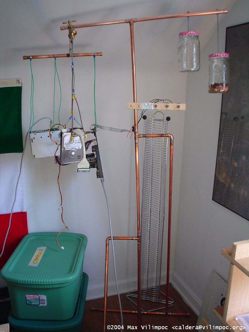 The fully assembled hanging computer with one counterweight jar filled with pennies