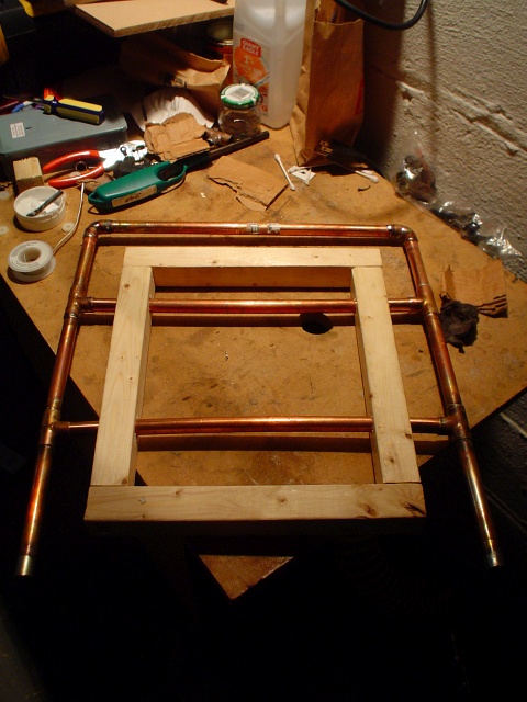 A view of the assembled wooden support frame with the copper tubing built through it