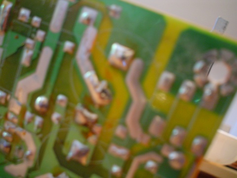 A very out of focus view of the backside of a printed circuit board
