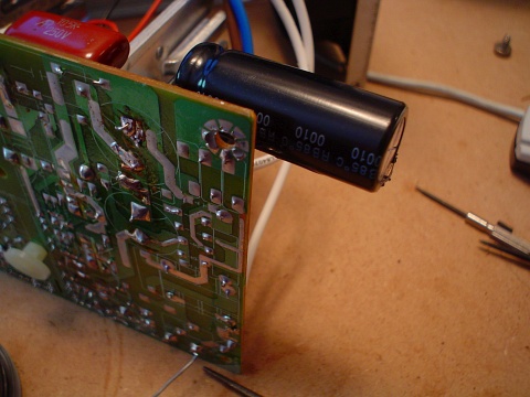 A view of the large capacitor soldered onto the ATX power supply to repair the damage